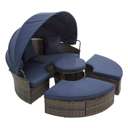 Lit de jour rond en rotin d'extérieur avec auvent et table basse relevable, canapé-lit bleu marine à assise profonde avec oreillers et coussins lavables